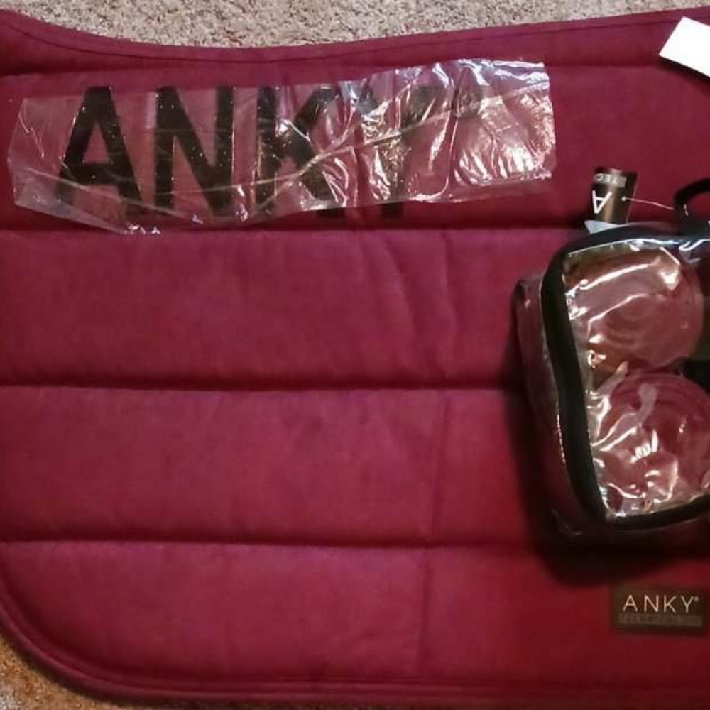 Anky " New Maroon" full dressage pad and polos. Both new with tags.